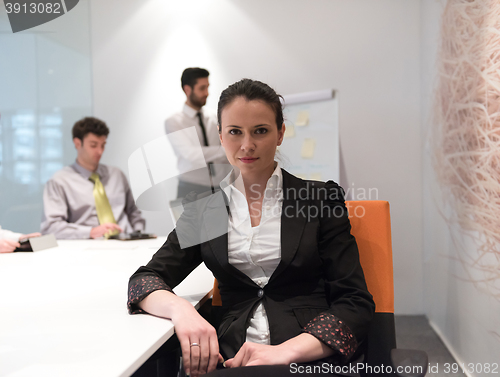 Image of young business woman on meeting  using laptop computer