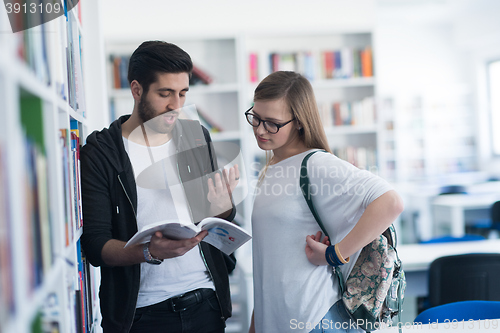 Image of students couple  in school  library