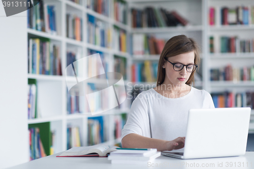Image of female student study in school library