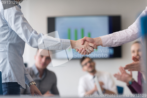 Image of business womans handshake