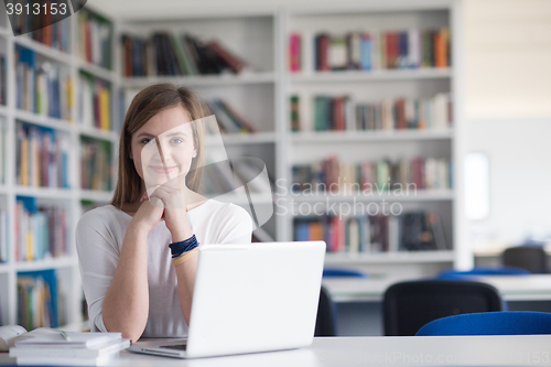 Image of female student study in school library