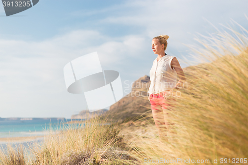 Image of Relaxed Happy Woman Enjoying Sun on Vacations.