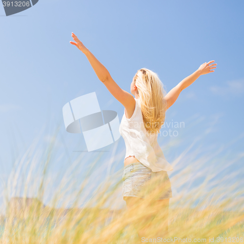 Image of Free Happy Woman Enjoying Sun on Vacations.