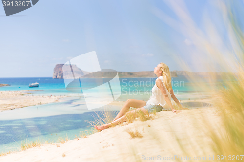 Image of Relaxed Happy Woman Enjoying Sun on Vacations.