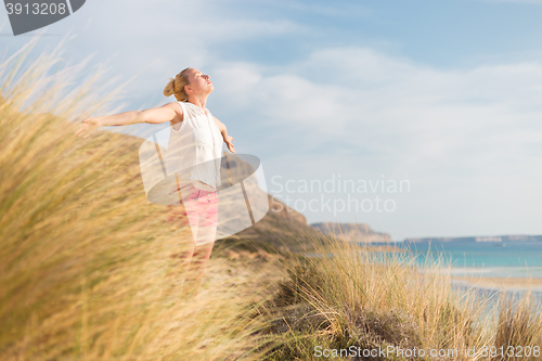 Image of Free Happy Woman Enjoying Sun on Vacations.