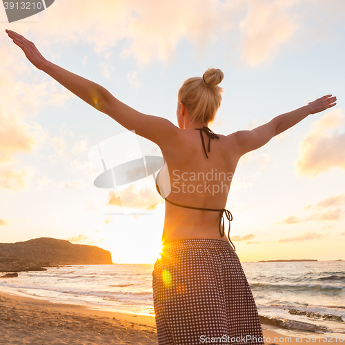 Image of Free Happy Woman Enjoying Sunset on Sandy Beach