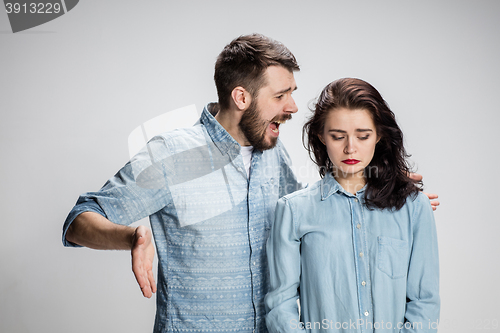 Image of The young couple with different emotions during conflict