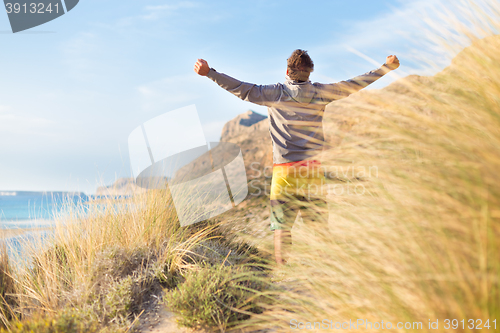 Image of Free active man enjoying beauty of nature.