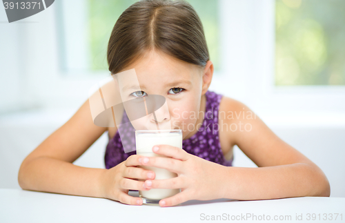 Image of Little girl with a glass of milk