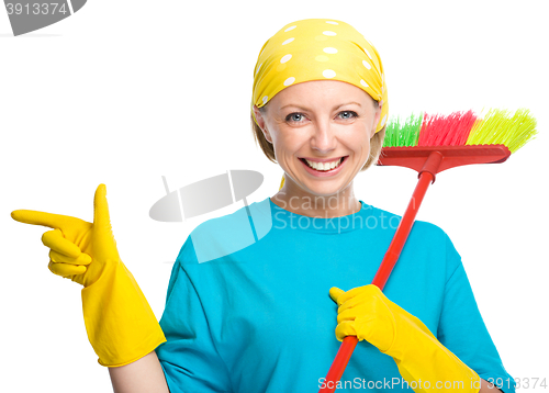 Image of Young woman as a cleaning maid