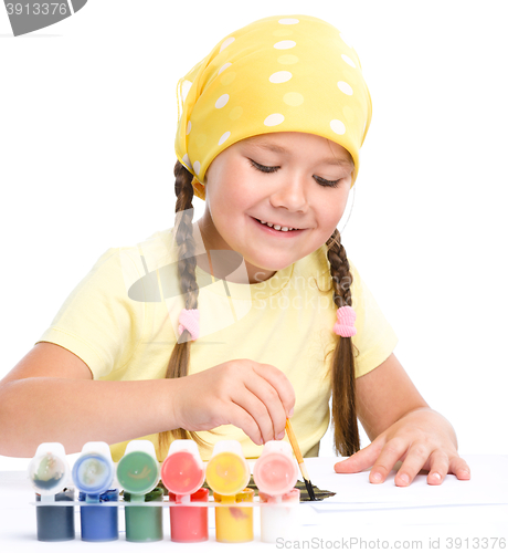 Image of Cute cheerful child play with paints