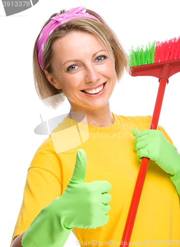 Image of Young woman as a cleaning maid