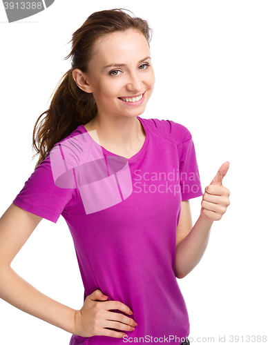 Image of Woman is showing thumb up gesture