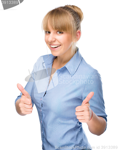 Image of Woman is showing thumb up gesture