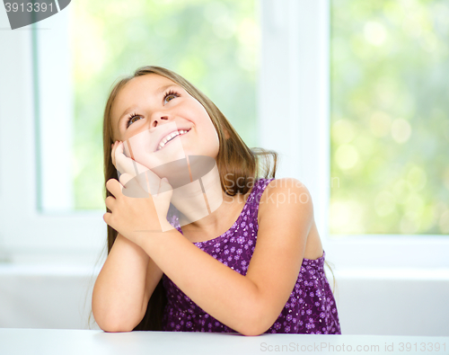 Image of Little girl is daydreaming