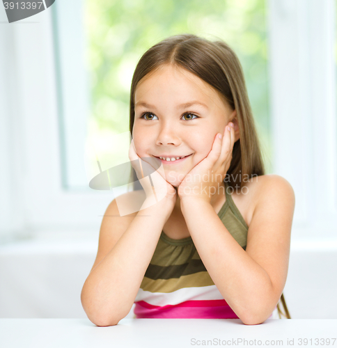 Image of Little girl is holding her face