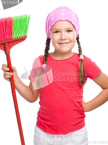 Image of Young girl is dressed as a cleaning maid