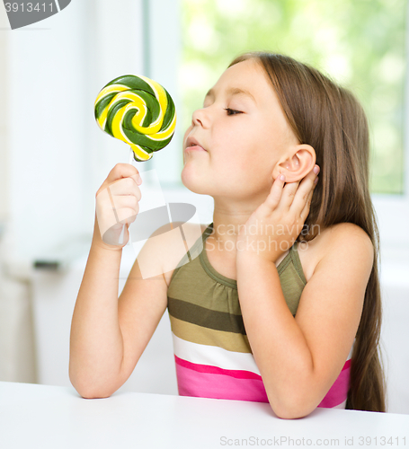 Image of Little girl with lollipop