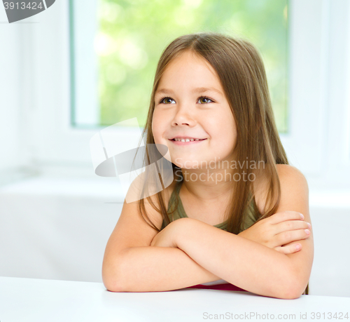 Image of Little girl is crossing her arms