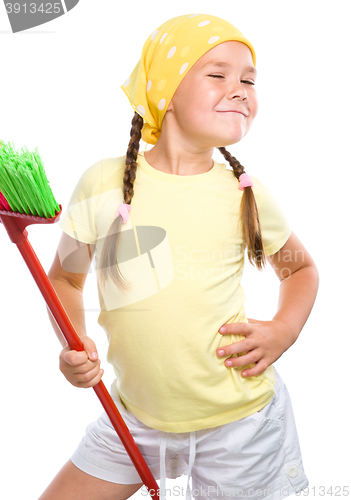 Image of Young girl is dressed as a cleaning maid