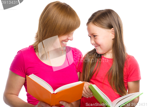 Image of Mother and her daughter are reading books