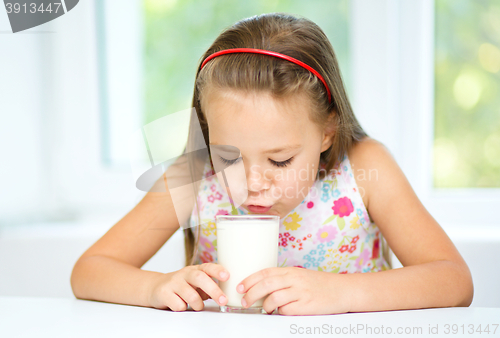 Image of Little girl with a glass of milk