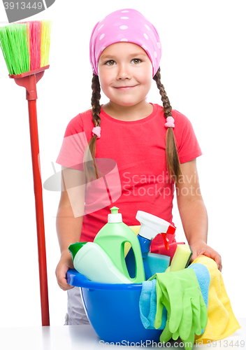 Image of Young girl is dressed as a cleaning maid