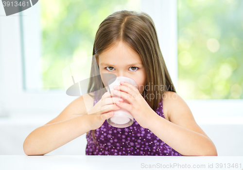 Image of Little girl with a glass of milk