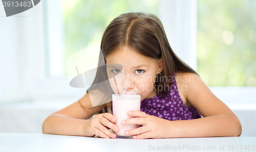 Image of Little girl with a glass of milk