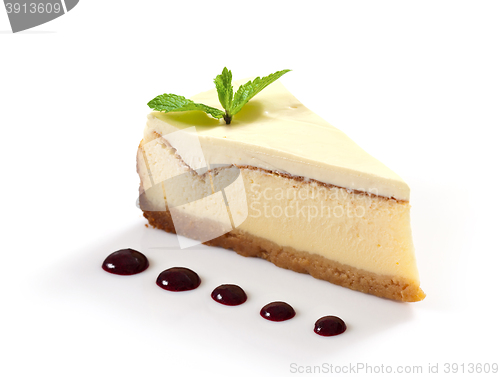 Image of cheesecake slice decorated with mint leaf