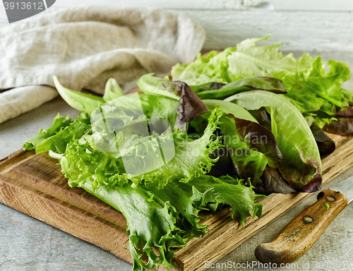 Image of fresh lettuce on wooden cutting board