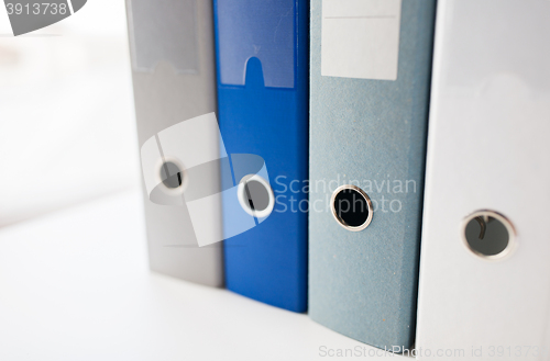 Image of close up of ring binders on office table