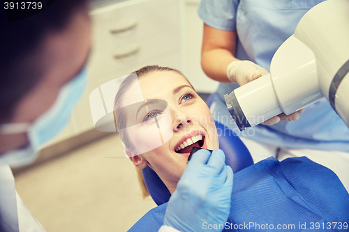 Image of female patient face with x-ray machine and shield