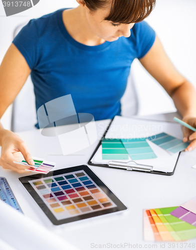 Image of woman working with color samples for selection