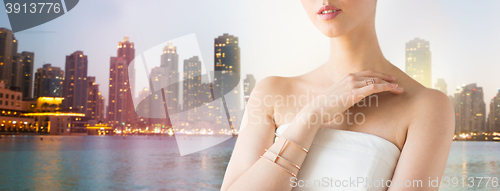 Image of close up of beautiful woman with ring and bracelet