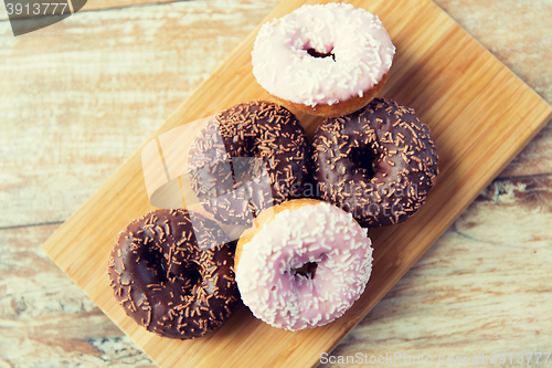 Image of close up of glazed donuts pile on table