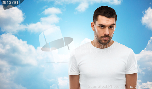 Image of young man portrait over sky and clouds background