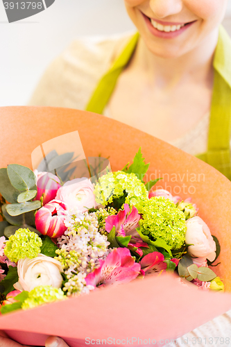 Image of close up of woman with bunch at flower shop