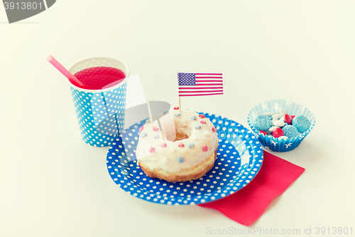 Image of donut with juice and candies on independence day