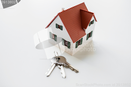 Image of close up of home model and house keys