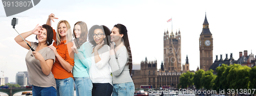 Image of group of happy women taking selfie in london