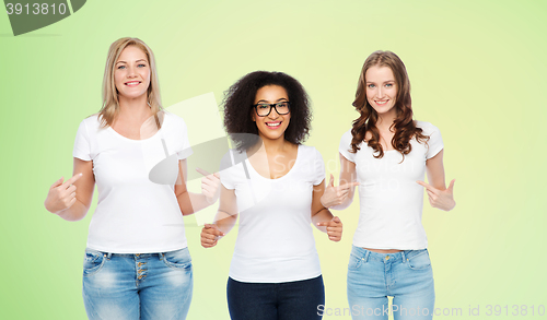 Image of group of happy different women in white t-shirts