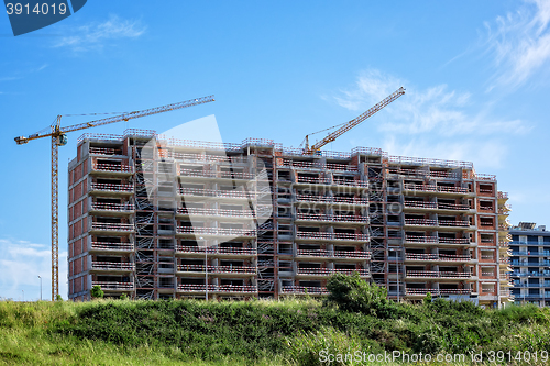 Image of Building Crane and Building Under Construction