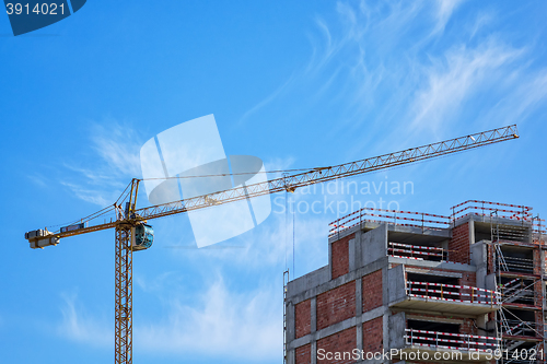 Image of Building Crane and Building Under Construction