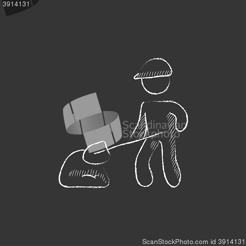 Image of Man with shovel and hill of sand. Drawn in chalk icon.