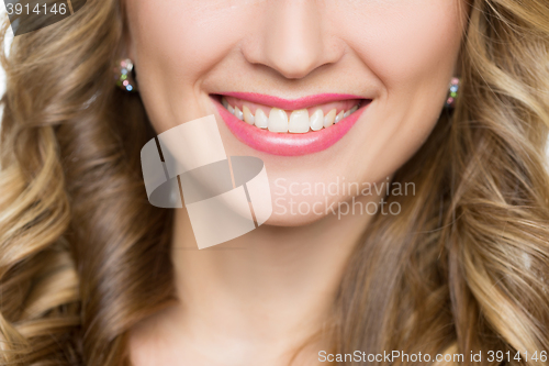 Image of Beautiful woman with long blond curly hair.