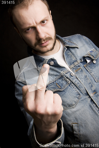 Image of young man giving the middle finger