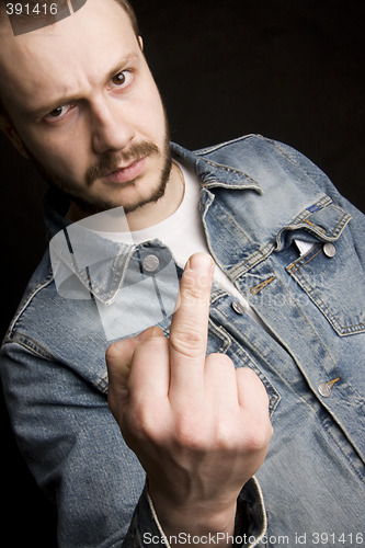 Image of young man giving the middle finger