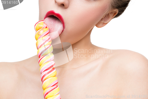 Image of Close-up shot of woman\'s mouth bright red lips with lollipop. blowjob simulation