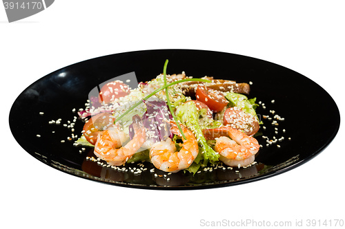 Image of perfect dish with shrimps on a black plate. seafood. Isolated  white background